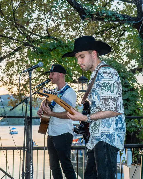 Retro Gringos performing at golden hour by the water